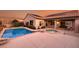 Inviting backyard oasis with a sparkling pool and spa at 2214 Brighton Point Ave, Henderson, NV 89044