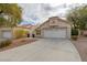 Single-story home with attached garage and landscaped front yard at 2400 Stadler Ct, Las Vegas, NV 89134