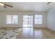 Living room features tile flooring, sliding door to patio, and lots of natural light at 2400 Stadler Ct, Las Vegas, NV 89134