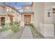 Two story home's exterior with landscaped walkway at 2505 Cockatiel Dr, North Las Vegas, NV 89084