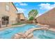 Refreshing pool and spa with a tranquil waterfall feature at 2505 Cockatiel Dr, North Las Vegas, NV 89084