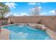 Relaxing pool area with waterfall, spa, and rock features at 2505 Cockatiel Dr, North Las Vegas, NV 89084