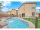 Stunning pool and spa surrounded by a beautiful yard at 2505 Cockatiel Dr, North Las Vegas, NV 89084