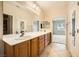 Double vanity bathroom with a view of a bedroom at 2551 Darda St, Henderson, NV 89044