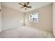 Well-lit bedroom with ceiling fan and window view at 2551 Darda St, Henderson, NV 89044