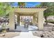 Covered outdoor BBQ area with seating and a built-in grill at 2555 Hampton Rd # 4302, Henderson, NV 89052