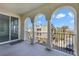 Private balcony with arched entryway and neighboring buildings view at 2555 Hampton Rd # 4302, Henderson, NV 89052