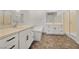 Elegant bathroom with double sinks, a soaking tub, and a walk-in shower at 2555 Hampton Rd # 4302, Henderson, NV 89052