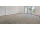 Bright bedroom with balcony access and neutral carpeting at 2555 Hampton Rd # 4302, Henderson, NV 89052