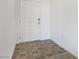 Simple entryway with white door and tiled floor at 2555 Hampton Rd # 4302, Henderson, NV 89052