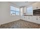 Bright kitchen nook with white cabinets and gray countertops at 2555 Hampton Rd # 4302, Henderson, NV 89052