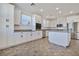 Modern kitchen with white cabinets, stainless steel appliances, and an island at 2555 Hampton Rd # 4302, Henderson, NV 89052