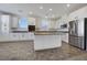 Modern kitchen with white cabinets, stainless steel appliances, and an island at 2555 Hampton Rd # 4302, Henderson, NV 89052