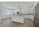 Modern kitchen with white cabinets, stainless steel appliances, and an island at 2555 Hampton Rd # 4302, Henderson, NV 89052