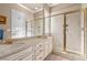 Elegant bathroom with double vanity, marble countertops, and a large shower at 2575 Grassy Spring Pl, Las Vegas, NV 89135