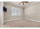 Bright bedroom with neutral carpeting and window shutters at 2575 Grassy Spring Pl, Las Vegas, NV 89135