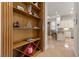 Built-in shelving in hallway, view into kitchen at 2575 Grassy Spring Pl, Las Vegas, NV 89135