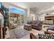 Bright living room with a large window and comfortable seating at 2575 Grassy Spring Pl, Las Vegas, NV 89135