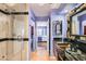 Spa-like bathroom with a large shower, double vanity, and a view of the bedroom at 2625 Seashore Dr, Las Vegas, NV 89128