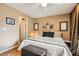 Bright bedroom with king bed, built-in desk, and hardwood floors at 2625 Seashore Dr, Las Vegas, NV 89128