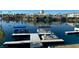 Private boat docks on a calm lake with clear water at 2625 Seashore Dr, Las Vegas, NV 89128