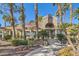 Community clubhouse with palm trees and landscaping at 2625 Seashore Dr, Las Vegas, NV 89128