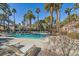 Relaxing community pool with lounge chairs and palm trees at 2625 Seashore Dr, Las Vegas, NV 89128