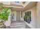 Inviting entryway with terracotta tile and potted plants at 2625 Seashore Dr, Las Vegas, NV 89128