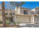 Charming two-story home with attached garage and landscaped front yard at 2625 Seashore Dr, Las Vegas, NV 89128