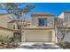 Two story home with attached garage and landscaping at 2625 Seashore Dr, Las Vegas, NV 89128