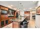 Modern kitchen with granite counters and wood cabinets at 2625 Seashore Dr, Las Vegas, NV 89128