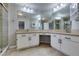 Bathroom with double vanity, granite countertop, and large mirror at 2714 Bridgepointe Dr, Las Vegas, NV 89121