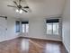 Spacious bedroom with hardwood floors, ceiling fan and large windows at 2714 Bridgepointe Dr, Las Vegas, NV 89121