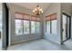 Bright dining area with large windows and a chandelier at 2714 Bridgepointe Dr, Las Vegas, NV 89121