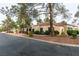 Tan colored stucco home with red tile roof and walkway at 2714 Bridgepointe Dr, Las Vegas, NV 89121