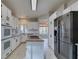 Updated kitchen with stainless steel appliances and island at 2714 Bridgepointe Dr, Las Vegas, NV 89121