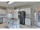 Spacious kitchen with granite countertops, white cabinets, and stainless steel appliances at 2714 Bridgepointe Dr, Las Vegas, NV 89121