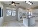 Kitchen with island, white cabinets, and tile flooring at 2714 Bridgepointe Dr, Las Vegas, NV 89121