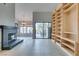 Living room with fireplace and large built-in shelving unit at 2714 Bridgepointe Dr, Las Vegas, NV 89121