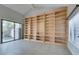 Living area with large built-in bookcase and sliding glass doors at 2714 Bridgepointe Dr, Las Vegas, NV 89121