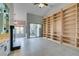 Living room with fireplace, built-in shelving and sliding glass doors at 2714 Bridgepointe Dr, Las Vegas, NV 89121