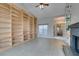 Living room boasts built-in bookshelves and tile flooring at 2714 Bridgepointe Dr, Las Vegas, NV 89121