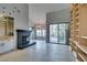 Bright living room with fireplace, built-in shelves, and sliding glass doors at 2714 Bridgepointe Dr, Las Vegas, NV 89121