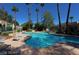 This community has a pool, lounge chairs, umbrellas, and mature landscaping at 2714 Bridgepointe Dr, Las Vegas, NV 89121