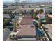 Community view showing houses with pools and a distant city view at 278 Iron Duke Ave, Las Vegas, NV 89183