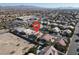 Aerial view of a house and neighborhood with a nearby elementary school at 278 Iron Duke Ave, Las Vegas, NV 89183