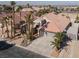 Single-story house with tile roof, large driveway, and desert landscaping at 278 Iron Duke Ave, Las Vegas, NV 89183