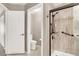 Updated bathroom featuring a tiled shower with glass door and neutral color palette at 278 Iron Duke Ave, Las Vegas, NV 89183