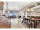 Open dining room with a large table, stylish chandelier, and modern furnishings at 278 Iron Duke Ave, Las Vegas, NV 89183