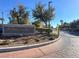 Welligton community entrance with manicured landscaping and secure gate access at 278 Iron Duke Ave, Las Vegas, NV 89183